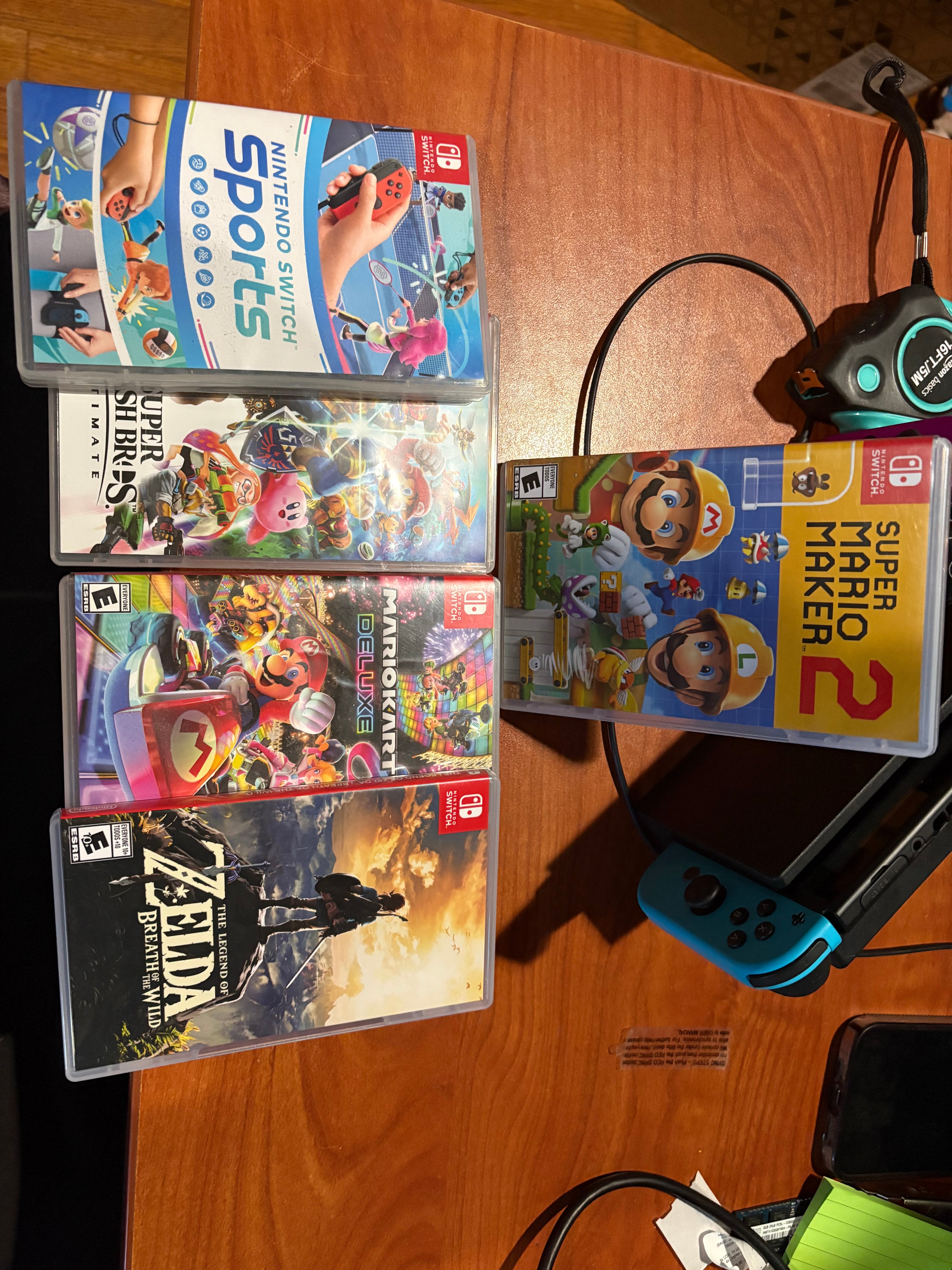 Nintendo switch w/ 4 controllers, 1 pro controller, 1 512gb SD card, and games bundle